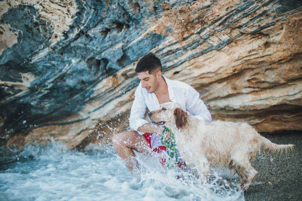 istock Man and best friend at the beach 827612030