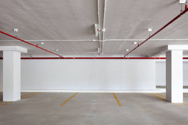istock New Parking garage interior, industrial building,Empty underground. 827615632