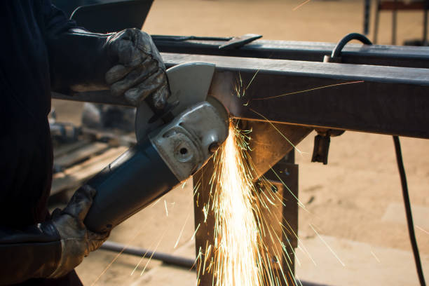 istock Man grinding metal with angle grinder 827619760