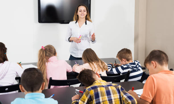 istock Boys and girls with teacher 827620470