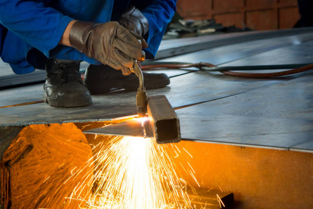 istock Man cutting metal with a welding cutting torch 827620488