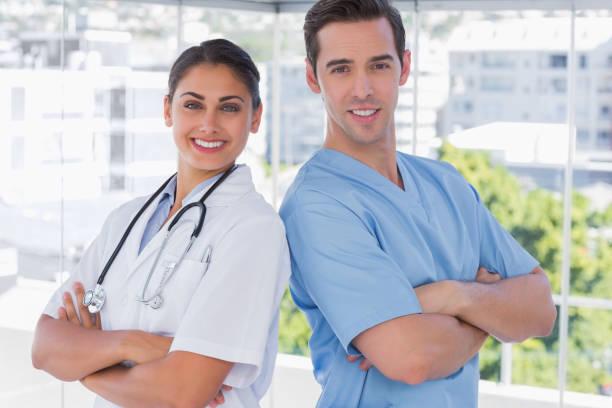 istock Medical staff standing with arms crossed 827622814