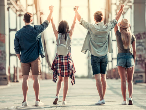 istock Young people walking outdoors 827623140