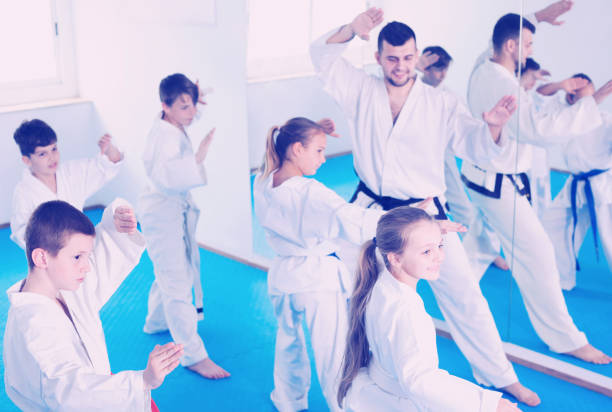 istock Smiling children attempting to master new moves 827623518