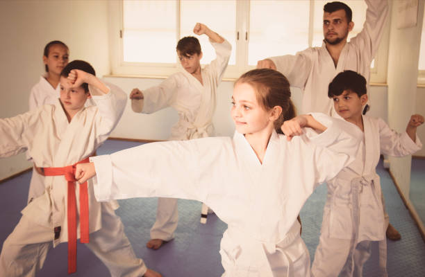 istock Happy children attempting to master new moves 827623670
