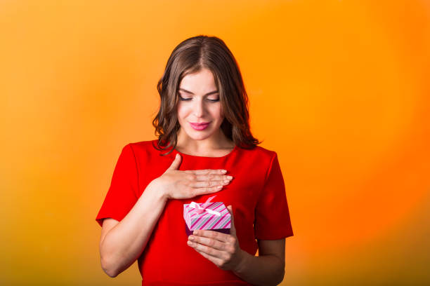 istock Beautiful woman with present box 827627382