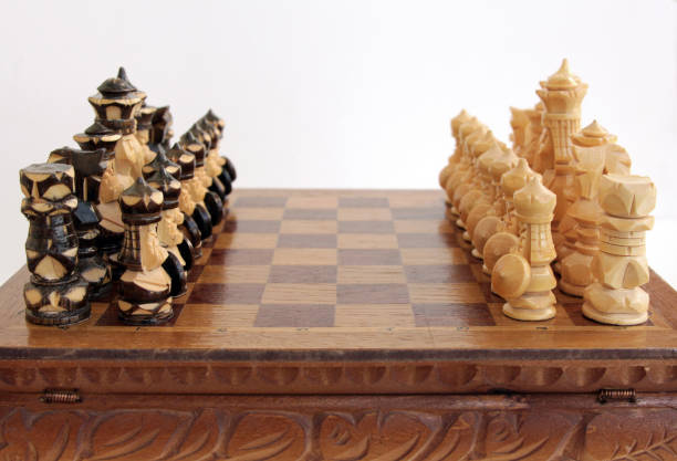 istock vintage handmade chess pieces on the Board 827632552
