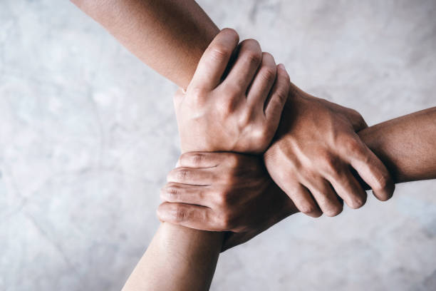 Hands together  showing teamwork. stock photo