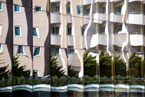 istock Reflection of glass windows of a building 827639680