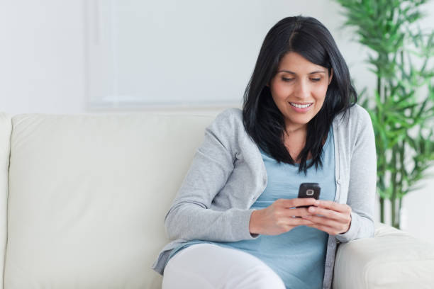 istock Woman writing on a phone 827646726