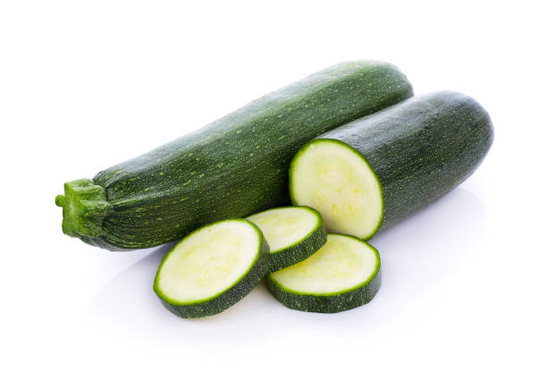 istock green zucchini vegetables isolated on white background 827646750