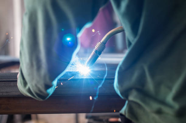 istock Industrial worker welding the steel structure in the workshop 827647152