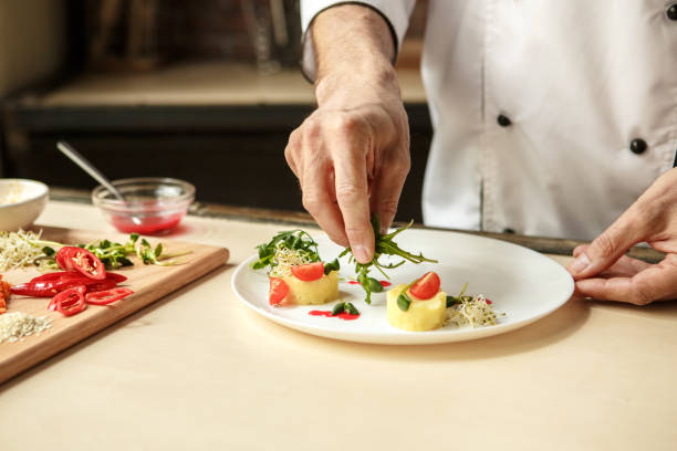 istock Mature man professional chef cooking meal indoors 827647596