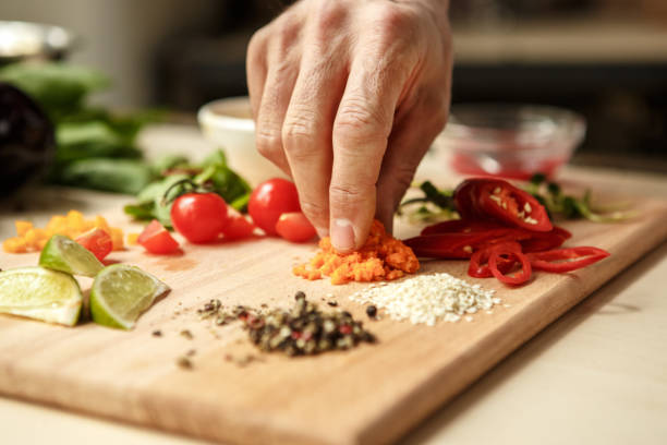 istock Mature man professional chef cooking meal indoors 827647696