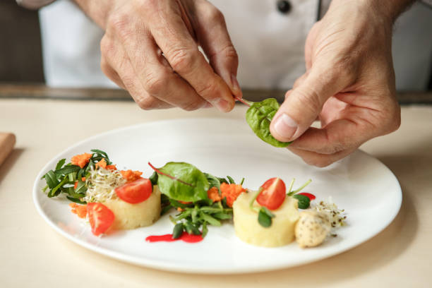 istock Mature man professional chef cooking meal indoors 827647864