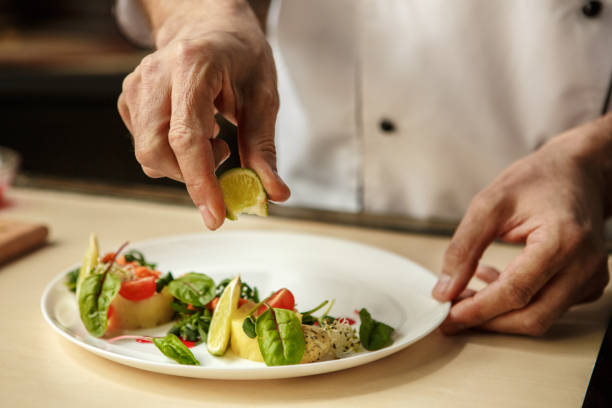 istock Mature man professional chef cooking meal indoors 827648082