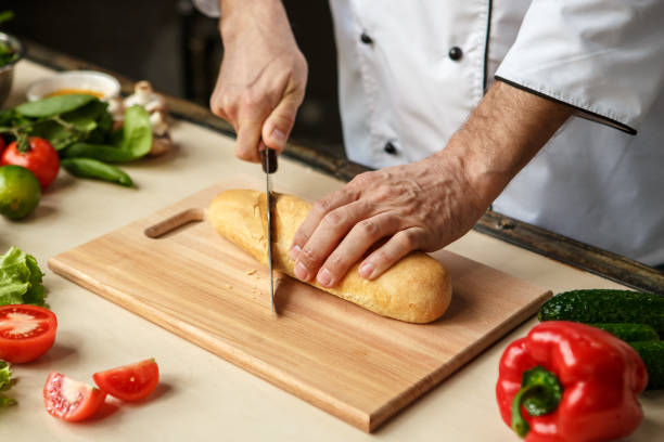 istock Mature man professional chef cooking meal indoors 827651678