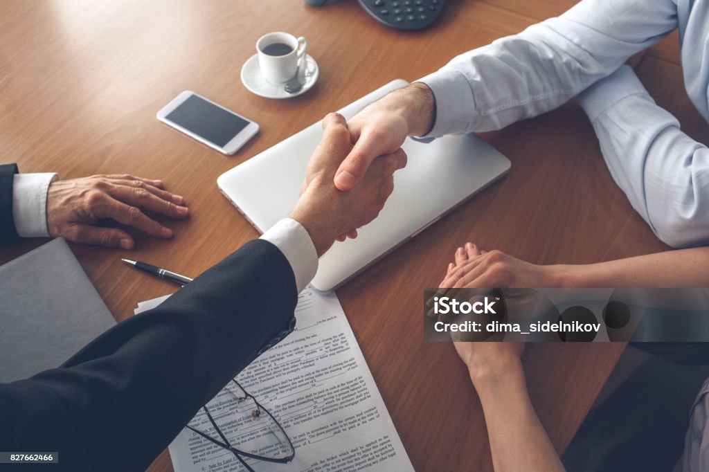 Young couple purchase rent property real estate Young couple consultation with agent purchase rent property real estate handshake Office Stock Photo