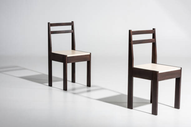 istock Two classic dark wooden chairs with white top 827667800