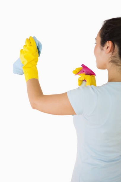 istock Woman cleaning walls 827670866
