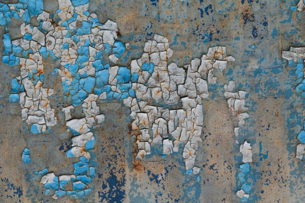 istock Background of peeling blue paint on an iron wall 827671632
