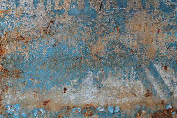 istock Background of peeling blue paint on an iron wall 827671818