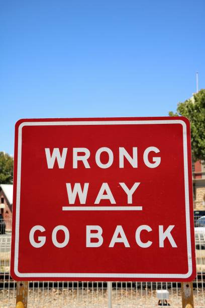 istock WRONG WAY - GO BACK Road sign in Australia 827691752