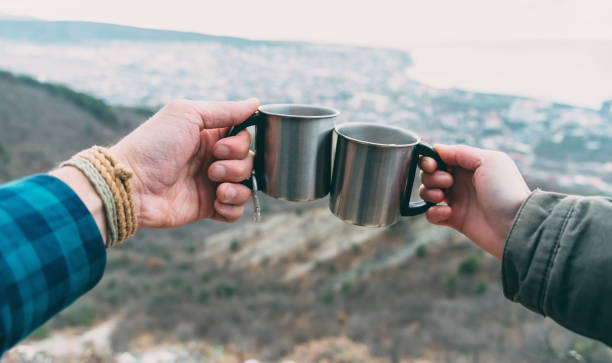 istock Couple drinking tea outdoor. 827691980