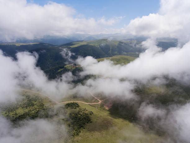 istock Aerial view of mountain village under clouds 827692092