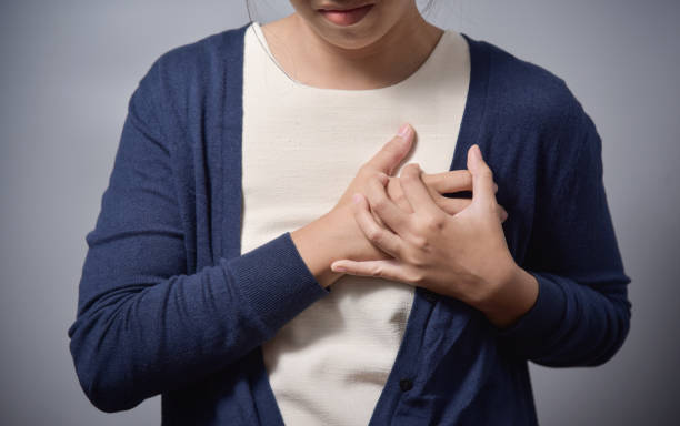 istock woman having chest pain. 827692306