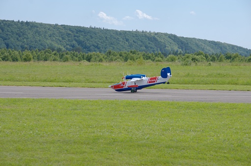 Penza Oblast, Russia - July 15, 2017: Radio control flying model of Be-12P-200 aircraft on runway. The Russian Aeromodelling Cup in Bolshoy Vyas village.