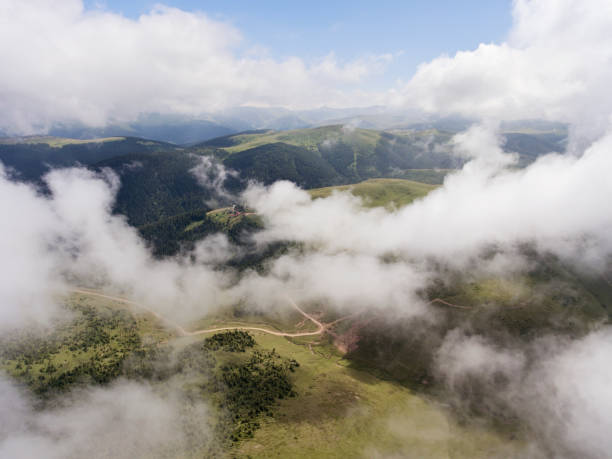 istock Aerial view of mountain village under clouds 827692428