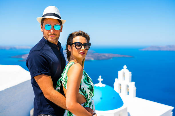 istock Happy young couple on Santorini island, Greece 827699872