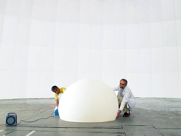 Scientist and engineer inflate weather balloon  weather balloon stock pictures, royalty-free photos & images