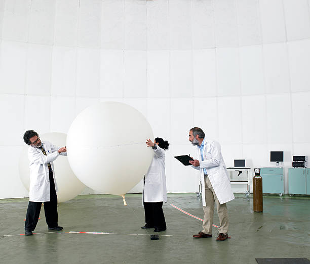 Scientists recording data in laboratory  weather balloon stock pictures, royalty-free photos & images