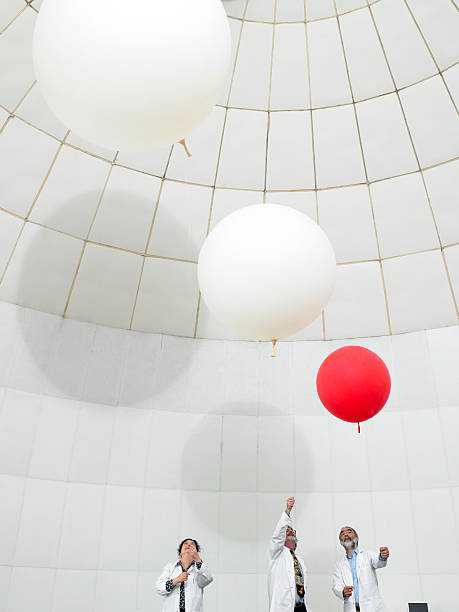scientists watch weather ballons float upwards  weather balloon stock pictures, royalty-free photos & images