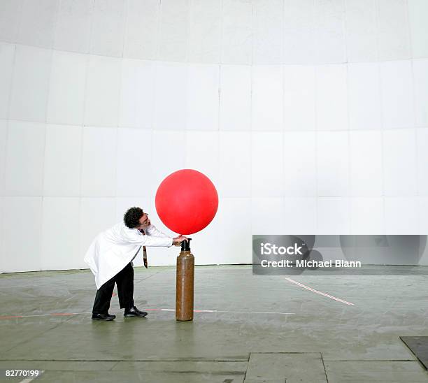 Scientist Blowing Up Weather Balloon With Air Stock Photo - Download Image Now - Balloon, Inflating, Scientific Experiment