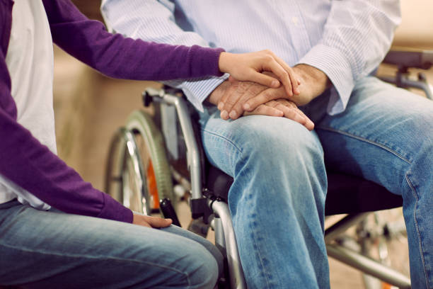 istock Elderly Lifestyle - care helping the disabled 827702698