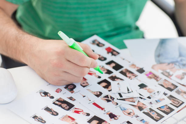 istock Photo editor marking contact photographs 827706102