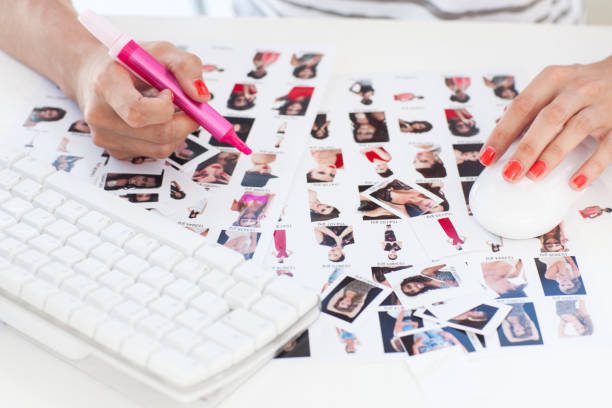 istock Female photo editor working on a contact sheet 827706356