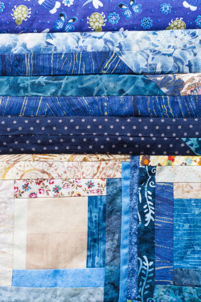 istock garment manufacturing, sewing, creativity, handiwork, decoration, arts and crafts cocnept - textile applique made of different in forms and colores patches with various nice patterns 827709360