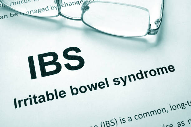 istock Paper with words Irritable bowel syndrome (IBS) and glasses. 827709474