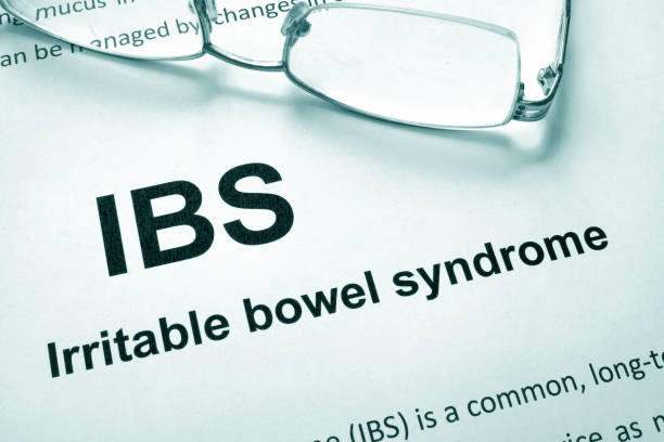 Paper with words Irritable bowel syndrome (IBS) and glasses. Paper with words Irritable bowel syndrome (IBS) and glasses. irritable bowel syndrome stock pictures, royalty-free photos & images