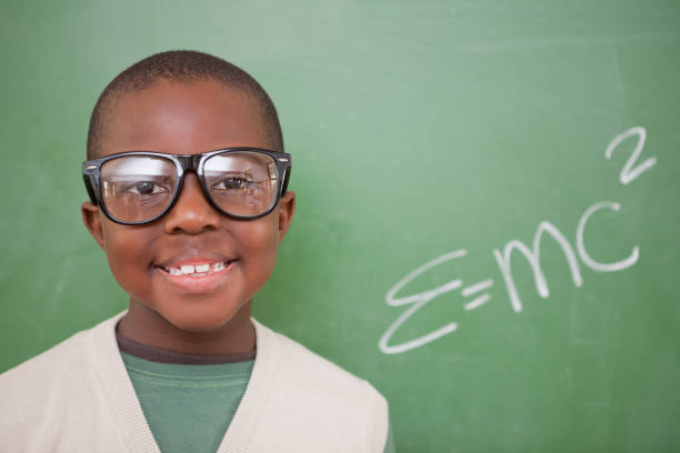 istock Schoolboy posing with the the massenergy equivalence formula 827714250