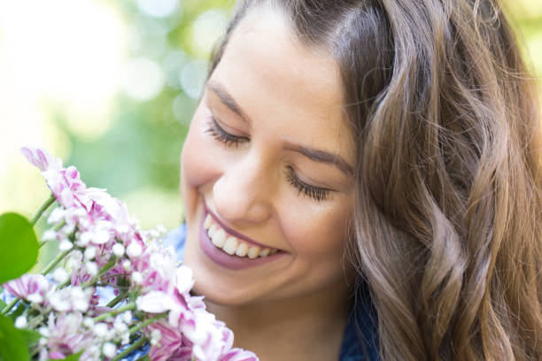 istock She really enjoys flowers 827714544