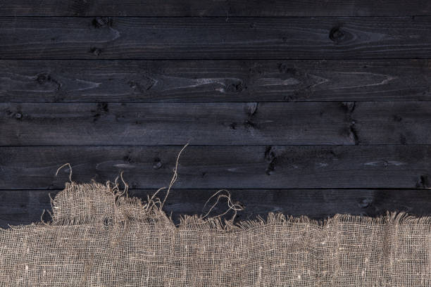 istock Dark wooden table with burlap 827715252