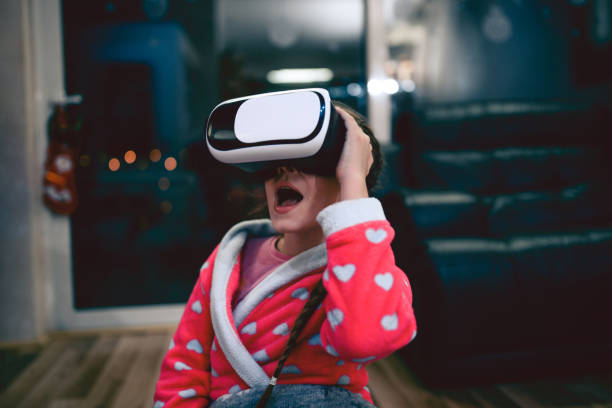 istock Little Girl Having Fun with Virtual Reality Simulator and Gesturing 827715488