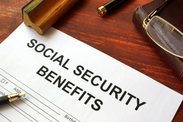 istock Social security benefits form, book and glasses. 827718158