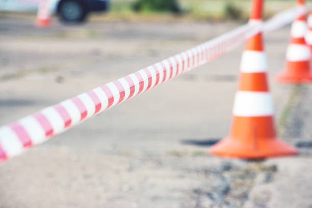 istock Fencing tape and road cone 827718170