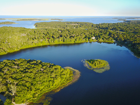 Aerial of the peaceful scenery in a freshwater lake on Cape Cod, Massachusetts. This peninsula has hundreds of small 